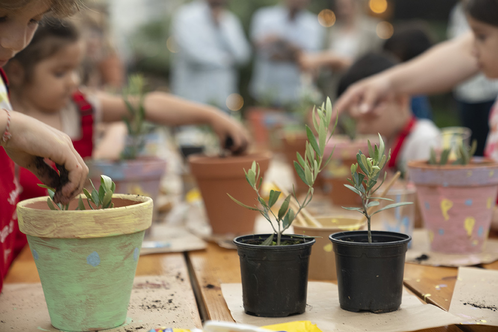 kids having fun with painting pots